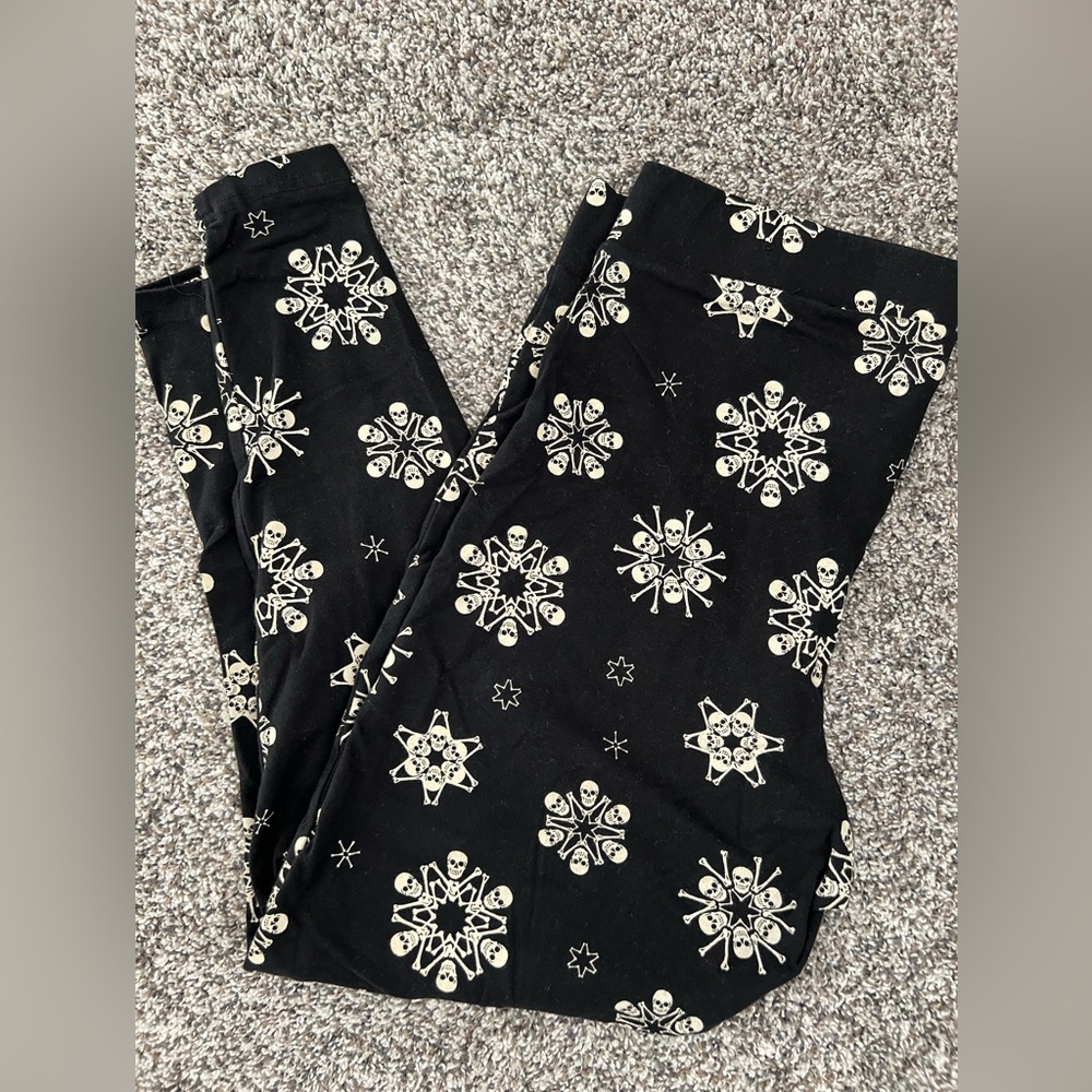 Torrid Black Leggings with Snowflake Skull Design